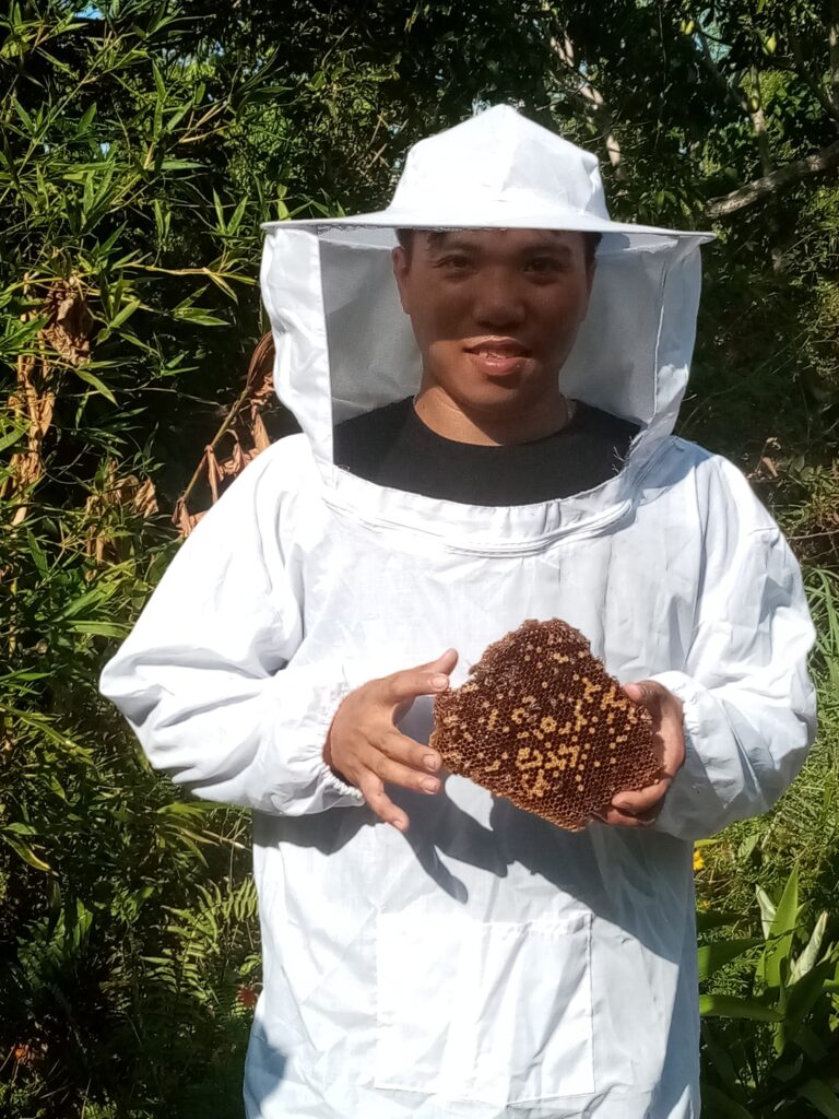 Harvesting healing honey from the our little hive at Kalipay Wellness.